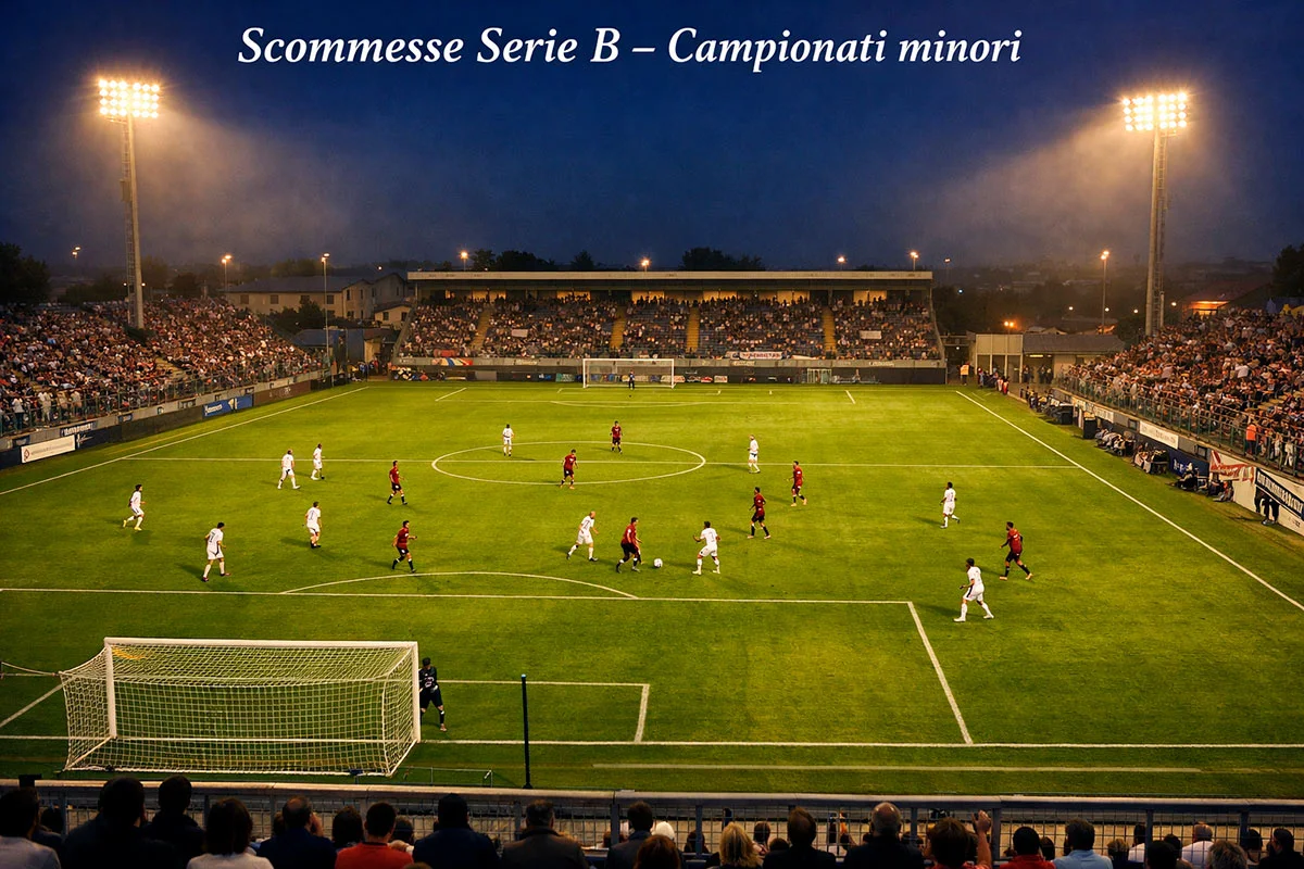 Stadio di Serie B italiano con tribune semideserte durante una partita serale sotto i riflettori